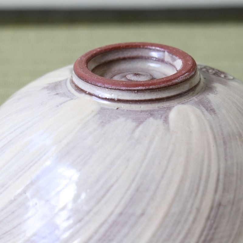 Close-up of the raised foot and pale lavender glazed underside of the Morisato Touraku Hira Chawan