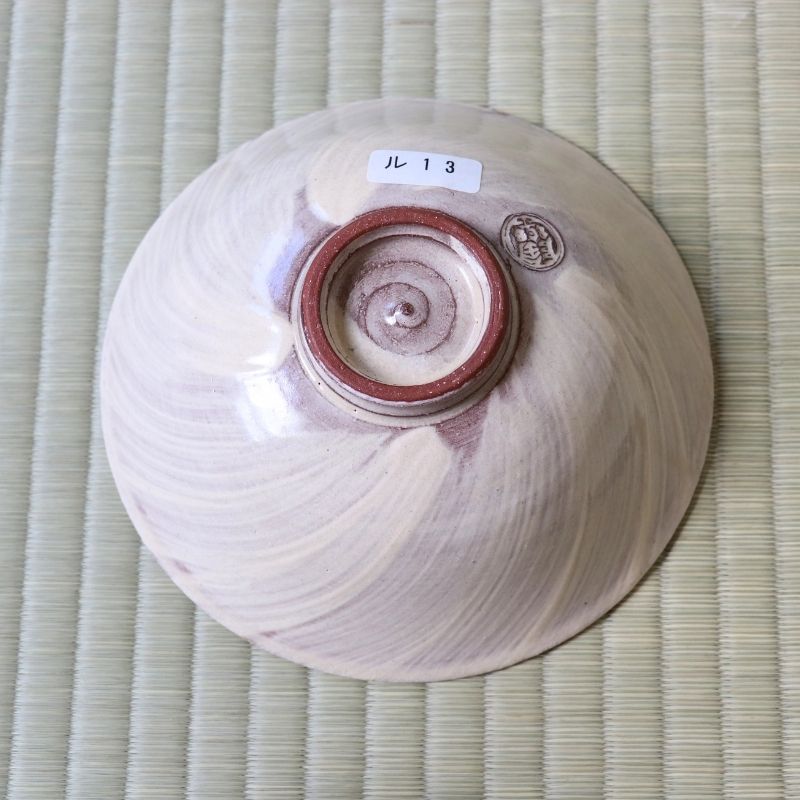 Bottom view of the Morisato Touraku purple floral Hira Chawan showing its raised ceramic foot