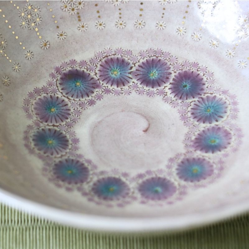 Close-up of the intricate purple and turquoise floral decoration inside the Morisato Touraku Hira Chawan