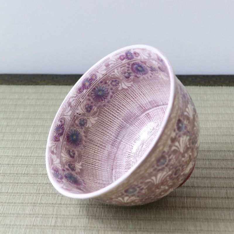 Angled view of the purple floral matcha bowl by Morisato Touraku showing the decorated interior and exterior