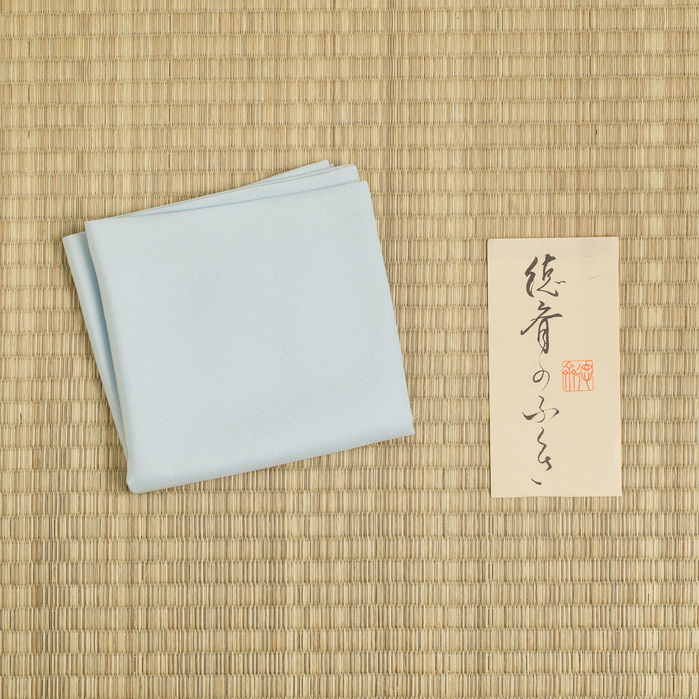 Powder blue silk fukusa displayed on tatami for Japanese Tea Ceremony