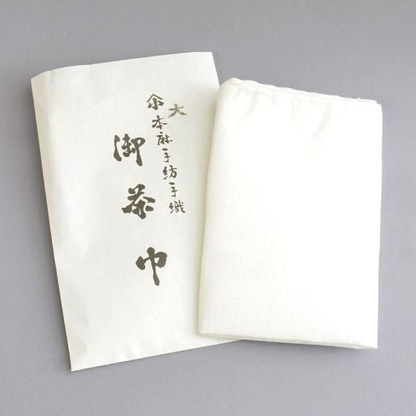White napkin with black text on a gray background