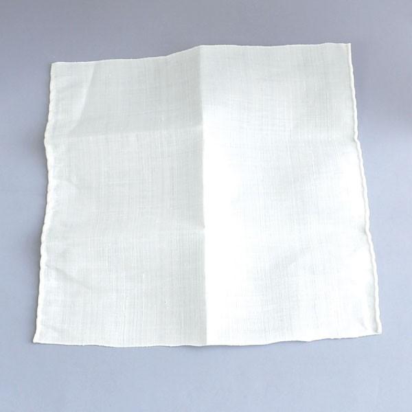 White fabric square on a gray background