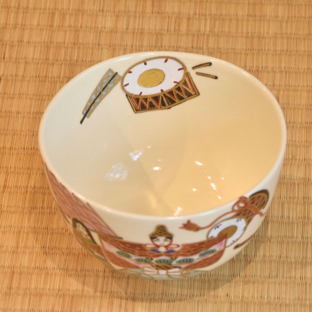 Top view of the Hina Matsuri matcha bowl showing its ivory interior and painted festival motifs continuing around the rim.