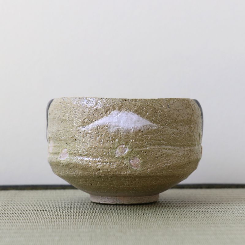 Light beige Kyo Ware matcha bowl by Shoraku Kiln with hand-painted Mount Fuji and cherry blossom design