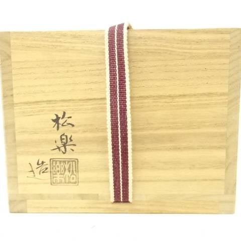 Closed wooden storage box with a paper label and decorative cord for the Shoraku Sasaki Matsukaze matcha bowl.