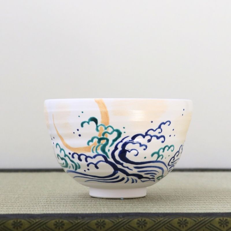 Kyo-yaki matcha bowl by Soken Mizuide featuring a crescent moon above stylized blue and turquoise waves on a soft white glaze