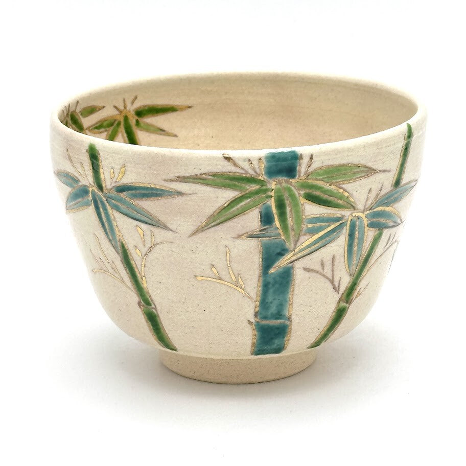 Hand-painted Kyo Ware matcha bowl with green and blue bamboo decoration and a refined gold foil accent along the rim