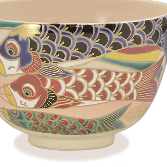 Ceramic bowl with fish design on a white background