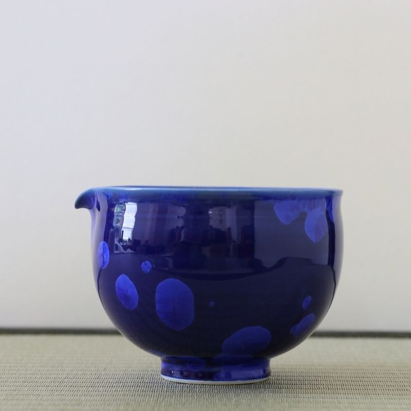 Tōan katakuchi matcha latte pouring bowl featuring a deep lapis blue Hana-Kesshō flower crystal glaze with lighter blue crystalline patterns