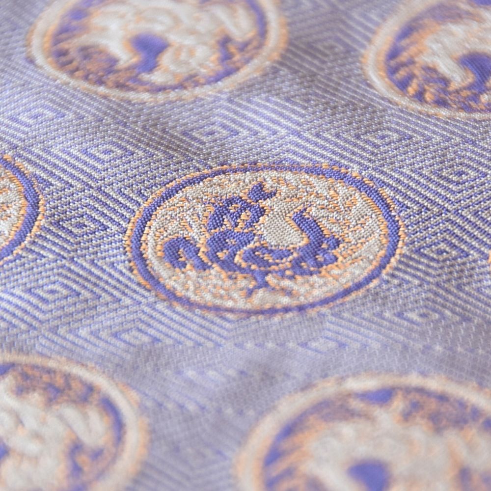 Close-up of the Torimaru Kin Futsu rooster medallion woven in Kyoto Nishijin silk for Chado, Sado and traditional Japanese tea ceremony.