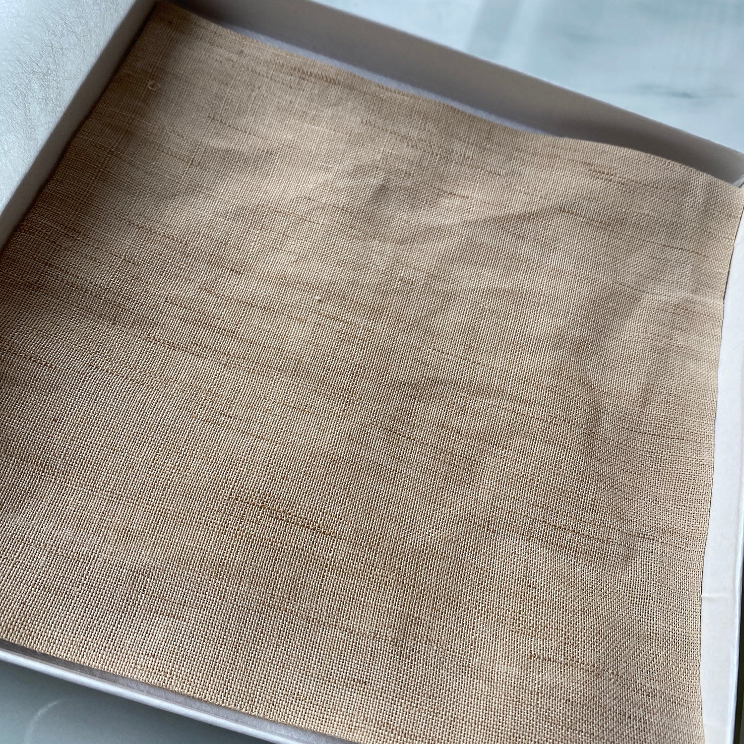 Close-up of traditional Japanese handwoven hemp fabric used for a kobukusa tea ceremony cloth