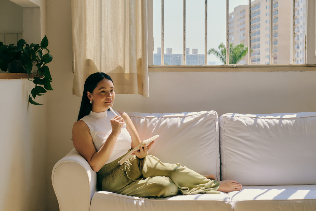 Women on the couch thinking about mindfulness