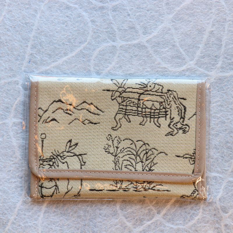 Small pouch with deer design on a textured gray background