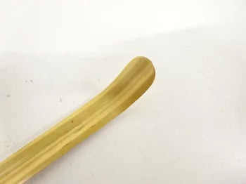 Wooden spoon on a white background