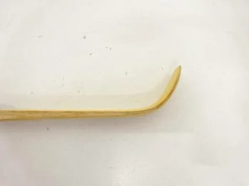Gold-colored object on a white background