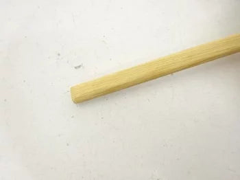 Single wooden stick on a white background