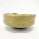 Beige ceramic bowl on a white background
