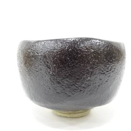 Black ceramic bowl on a white background