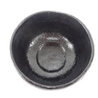 Black ceramic bowl on a white background