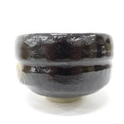 Black ceramic cup on a white background