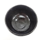 Black ceramic bowl on a white background