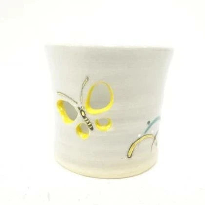 Ceramic mug with butterfly design on a white background