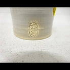 Ceramic cup with a logo on a white background