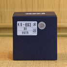 Blue box with labels on a wooden surface