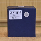 Blue box with labels on a textured brown background