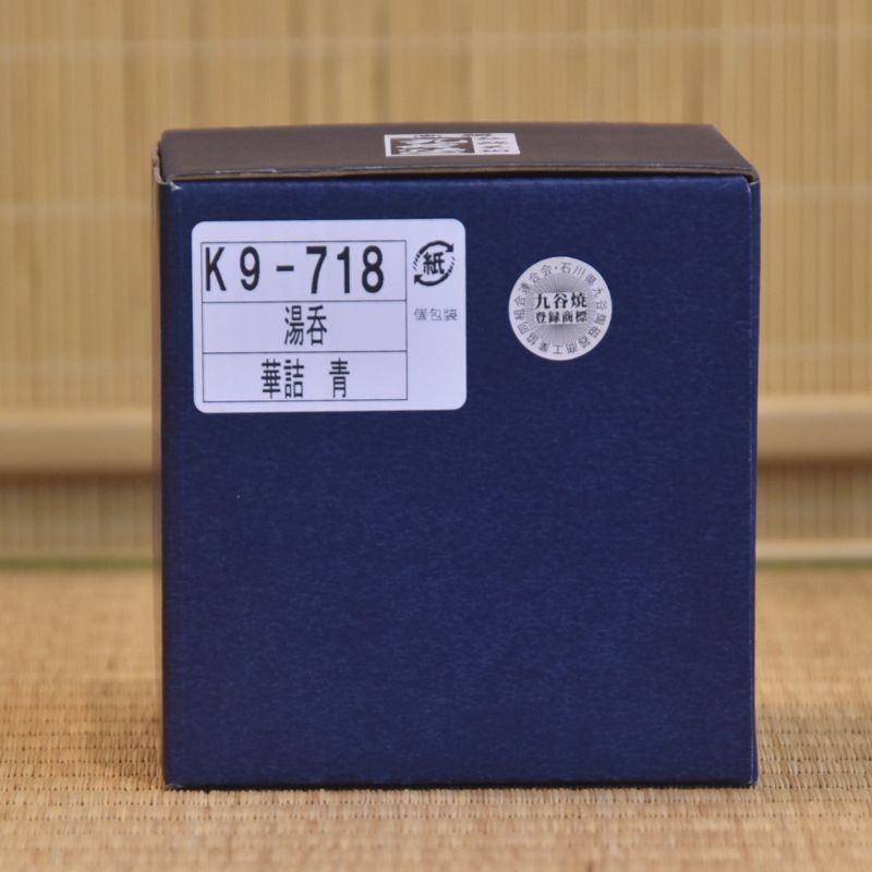 Blue box with labels on a textured brown background