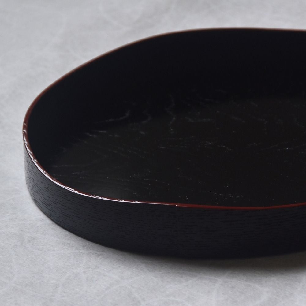 Black tray on a gray background