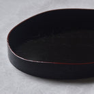 Black tray on a gray background
