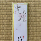 Decorative card with floral design on a textured beige background