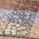 Close-up of fabric swatches with floral patterns in various colors.
