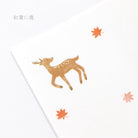Illustration of a deer with autumn leaves on a light background