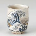 Ceramic cup with wave design on a gray background