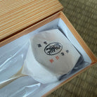 Packaged product with a wooden box on a woven mat background
