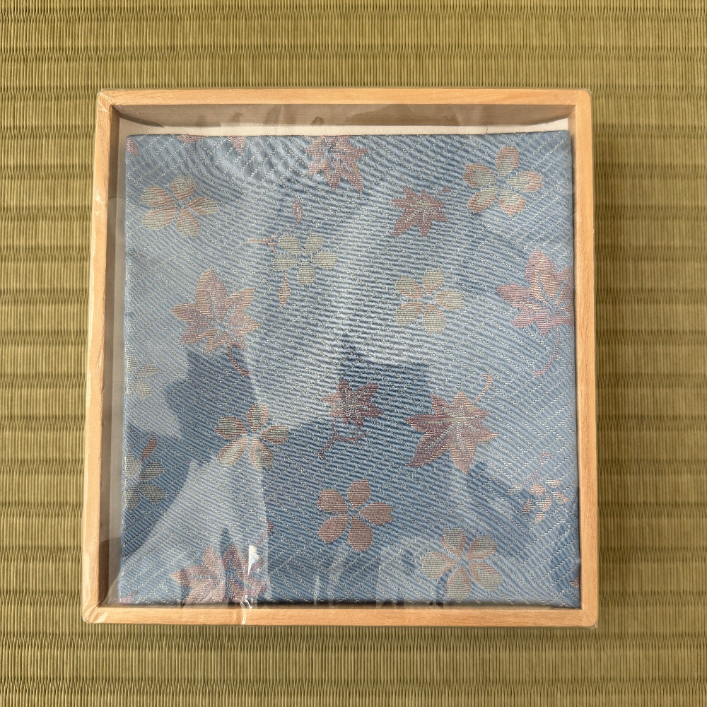 Packaged product with floral design on a textured green background