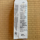White package with text on a wooden surface