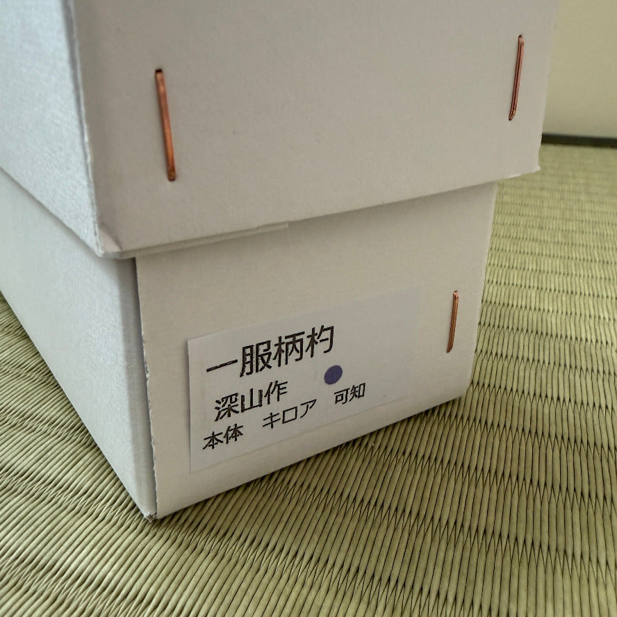 White box with text on a textured surface