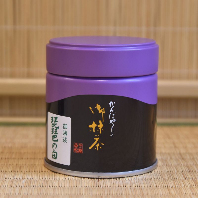 A can of Biwa no Shiro Ceremonial Grade Matcha by Kanbayashi_Shunsho with Japanese characters displayed on the label.