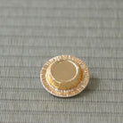 Back of a gold-colored Lacto resin lid for a Japanese tea caddy