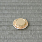 Back of a gold-colored Lacto resin lid for a Japanese tea caddy