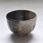 Ceramic bowl with floral patterns on a white background