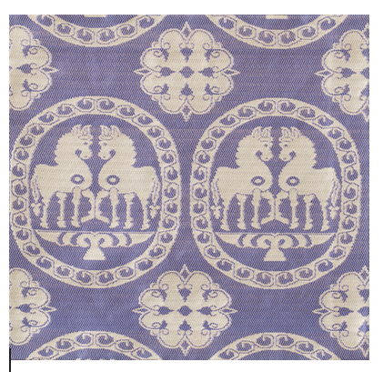 Patterned fabric with horse design on a blue background