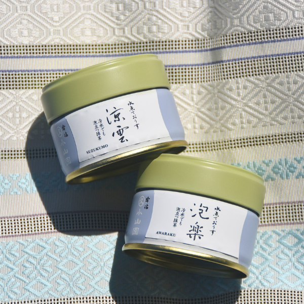 two Matcha cans of Marukyu Koyamaen on a cloth
