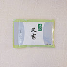 A bag of YUGEN Marukyu Koyamaen Matcha with Japanese characters on the label, predominantly in a light blue and green color scheme.