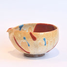 Ceramic bowl with abstract design on a white background