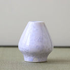 White textured diffuser on a light surface with a neutral background